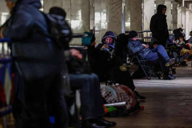 People take shelter inside a metro station during overnight Russian missile and drone attack, in Kyiv