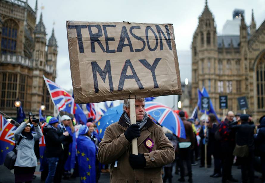 Pro-Brexit and anti-Brexit protesters demonstrate outside the Houses of Parliament in London