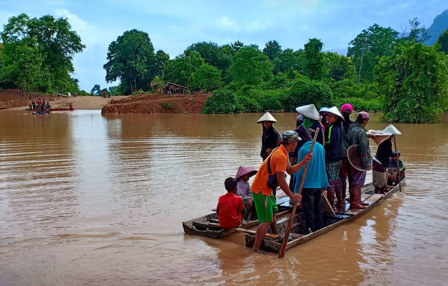 Villagers are evacuated after the Xepian-Xe Nam Noy hydropower dam collapsed in Attapeu province