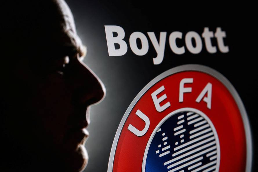 Illustration shows silhouette of Gianni Infantino, FIFA President, UEFA logo and word "Boycott\