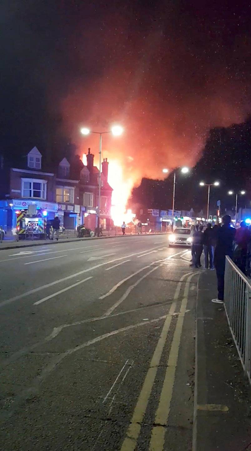 Flames leap into the sky from the site of an explosion in Leicester