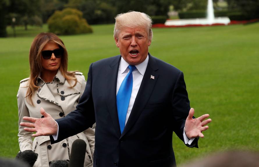 Trump speaks to reporters as he leaves the White House in Washington