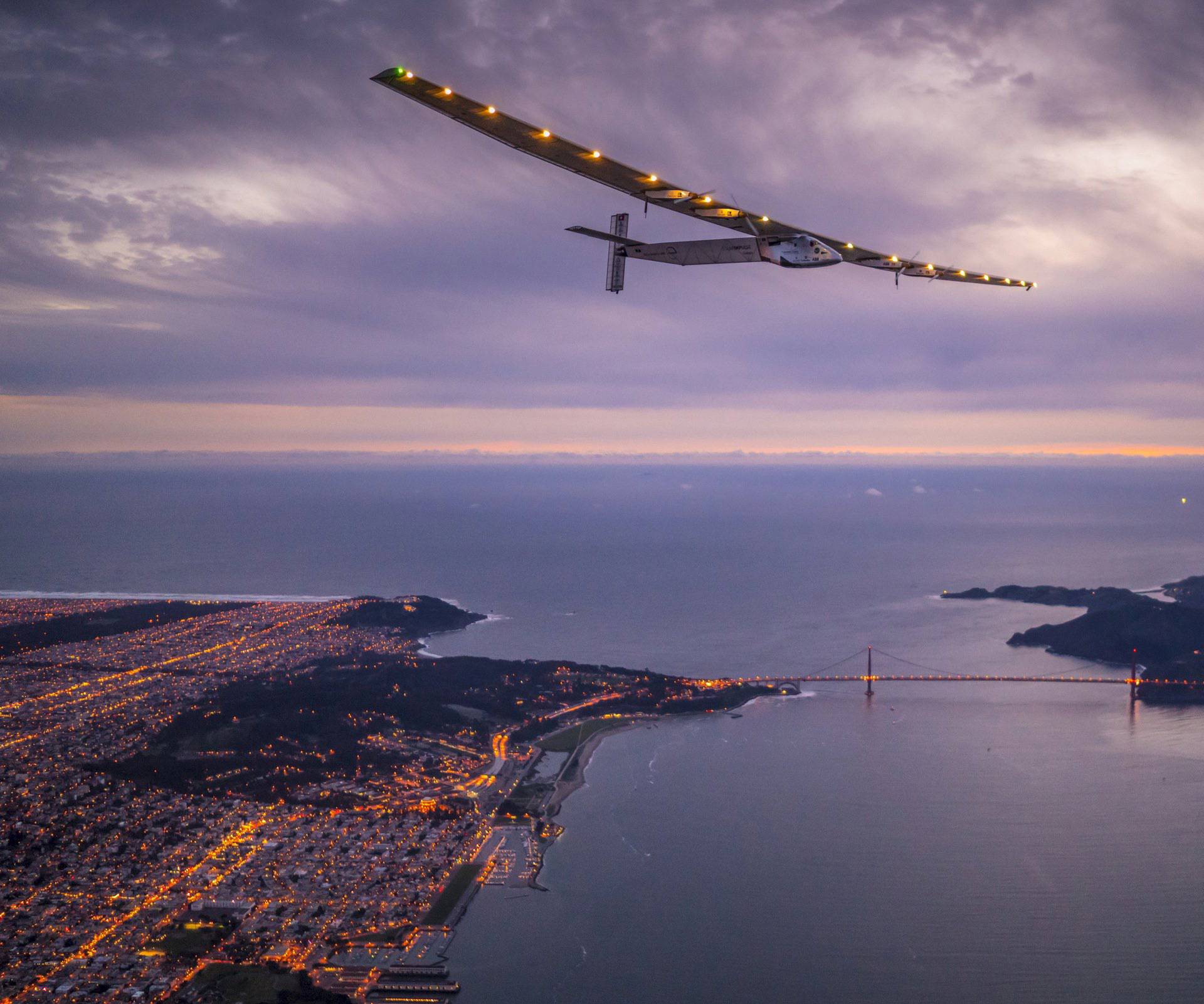 "Solar Impulse 2", a solar-powered plane piloted by Bertrand Piccard of Switzerland, flies over the Golden Gate bridge in San Francisco