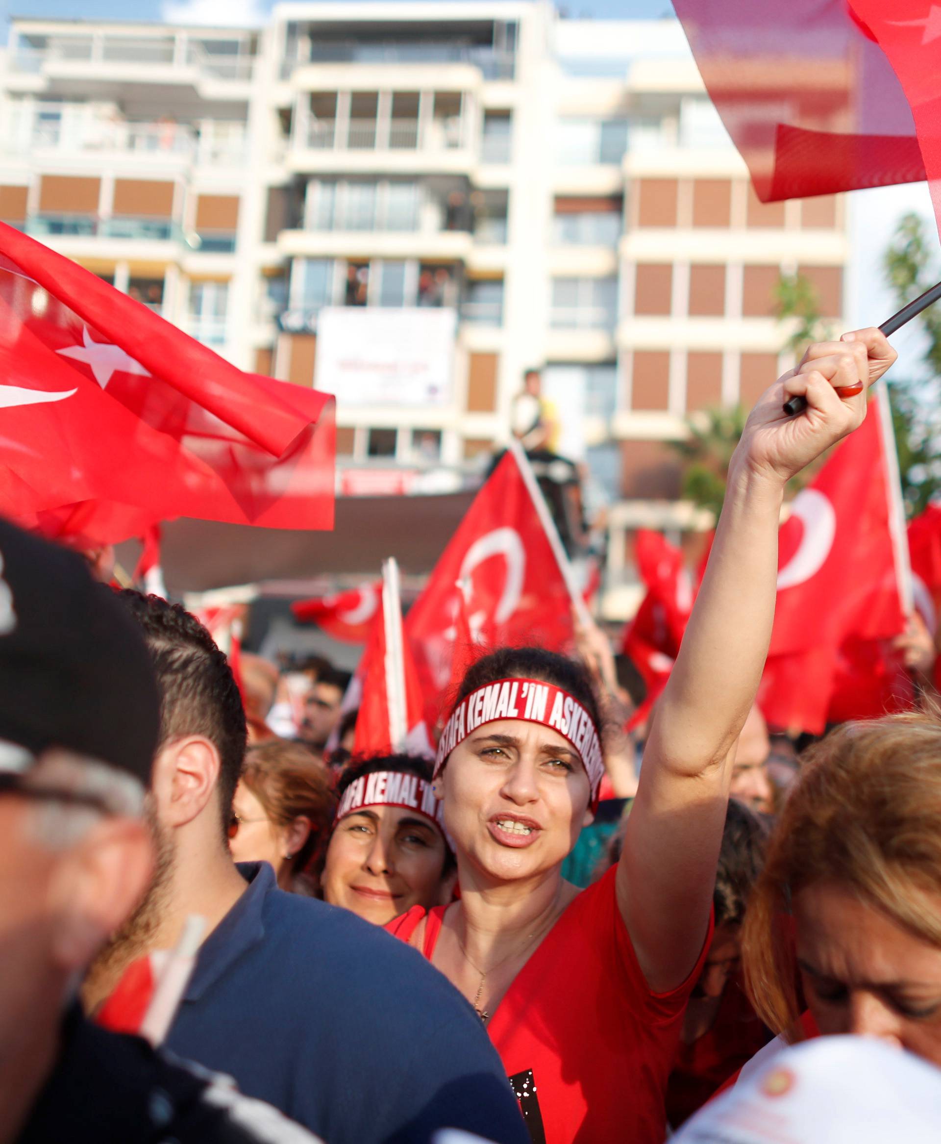 Supporters of Muharrem Ince, presidential candidate of the main opposition Republican People's Party (CHP), wave flags during an election rally in Izmir