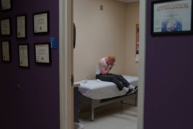 Emmanuel Rutema, a Tanzanian with Albinism who had his arm chopped off in a superstition-driven attack, waits for his new prosthetic arm at the Shriners Hospital in Philadelphia