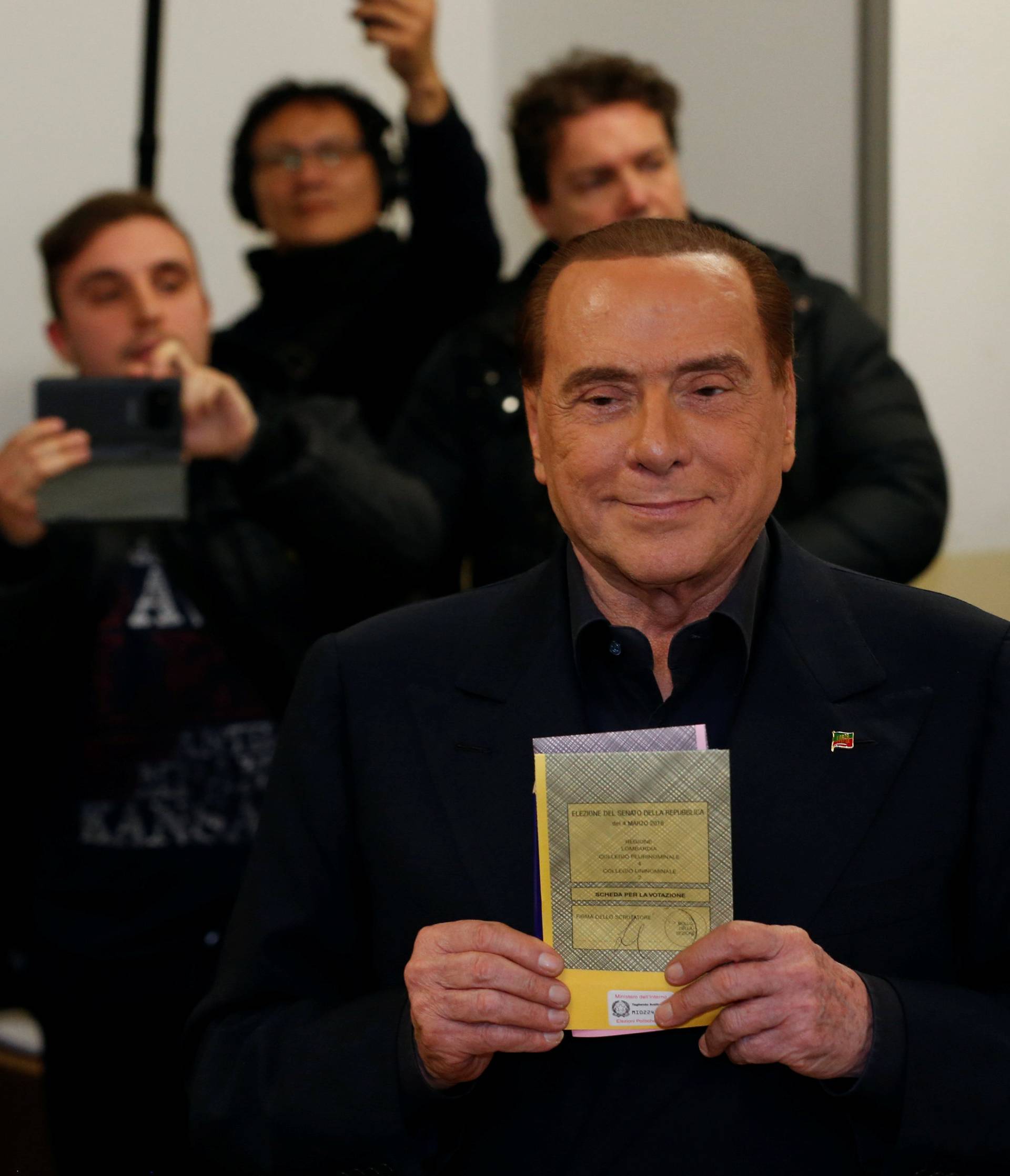 Forza Italia party leader Silvio Berlusconi casts his vote at a polling station in Milan