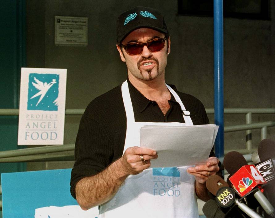 FILE PHOTO: Singer George Michael reads a statement at the headquarters of Project Angel Food in Los Angeles