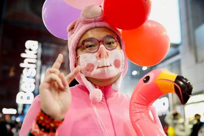 Reveller dressed in costume poses for a photograph in Shibuya during Halloween, amid the coronavirus disease (COVID-19) pandemic, in Tokyo