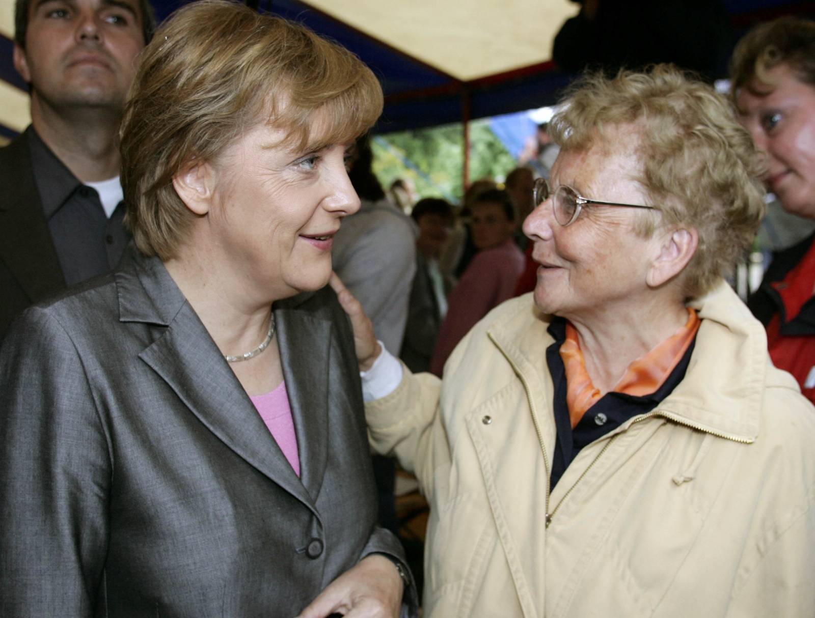 FILE PHOTO: Conservative challenger Merkel talks to her mother Kasner during an election campaign rally in Templin