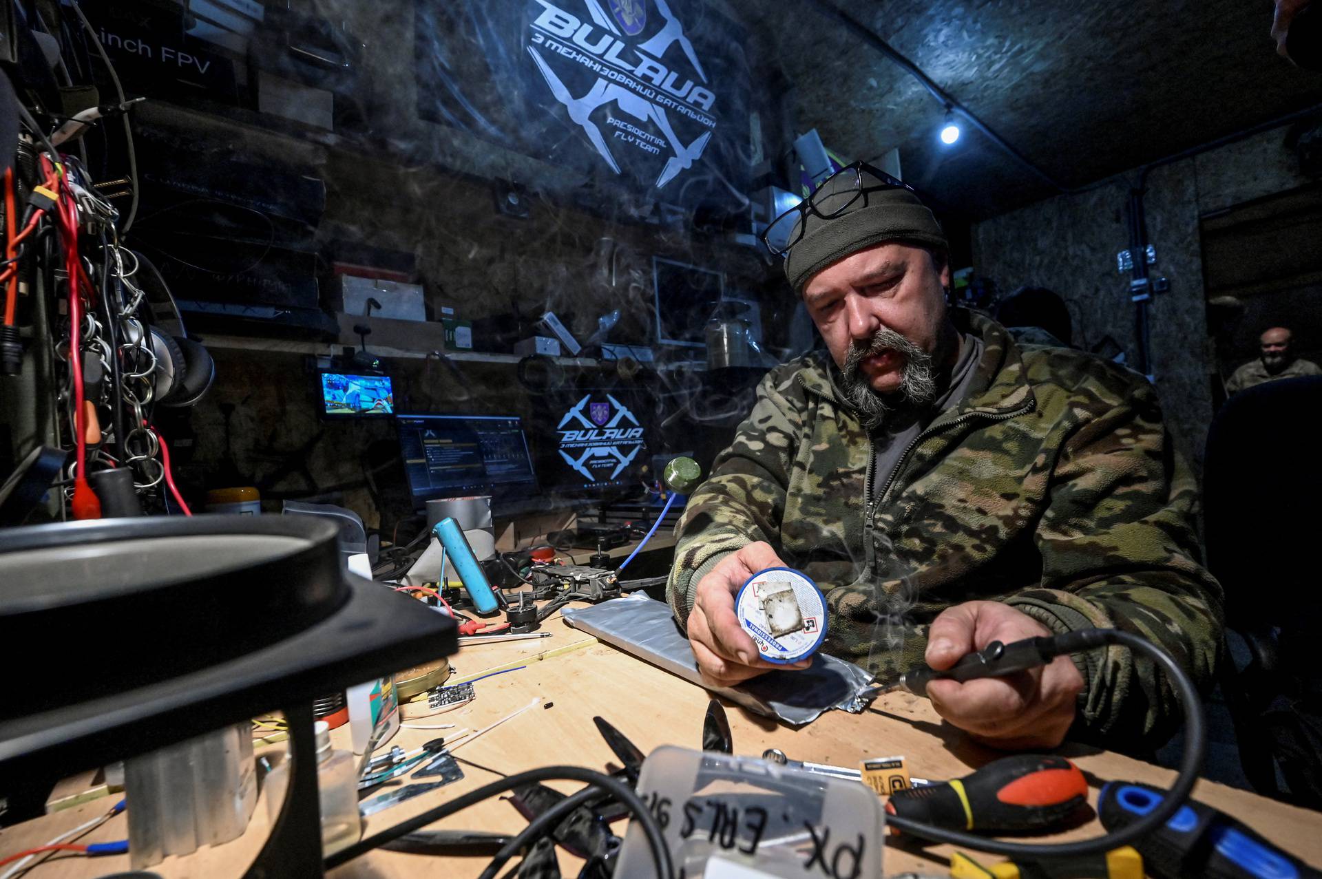 Ukrainian serviceman works with FPV drones at a workshop at their position near a frontline in Zaporizhzhia region