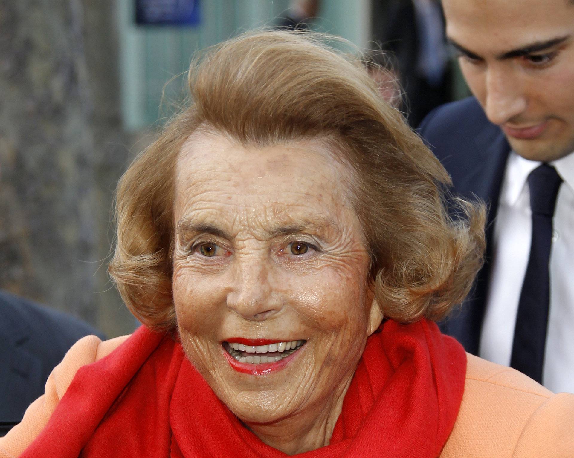 FILE PHOTO: Liliane Bettencourt, heiress to the L'Oreal fortune leaves with Jean-Victor Meyers, her grandson, the L'Oreal-UNESCO prize for women in Paris