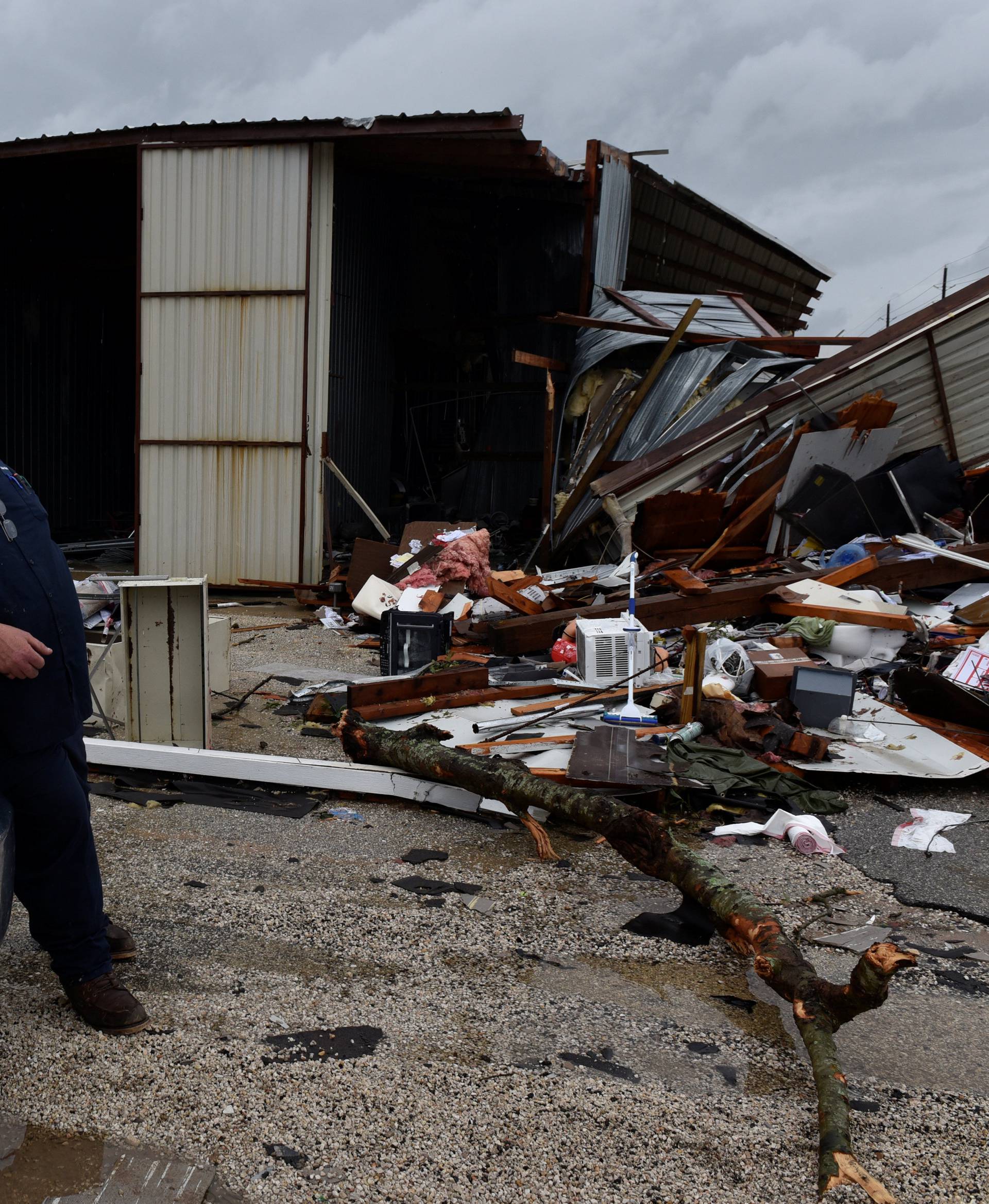 Richard Hardy looks over damage from a tornado that spun off of Hurricane Harvey after the storm made landfall on the Texas Gulf coast