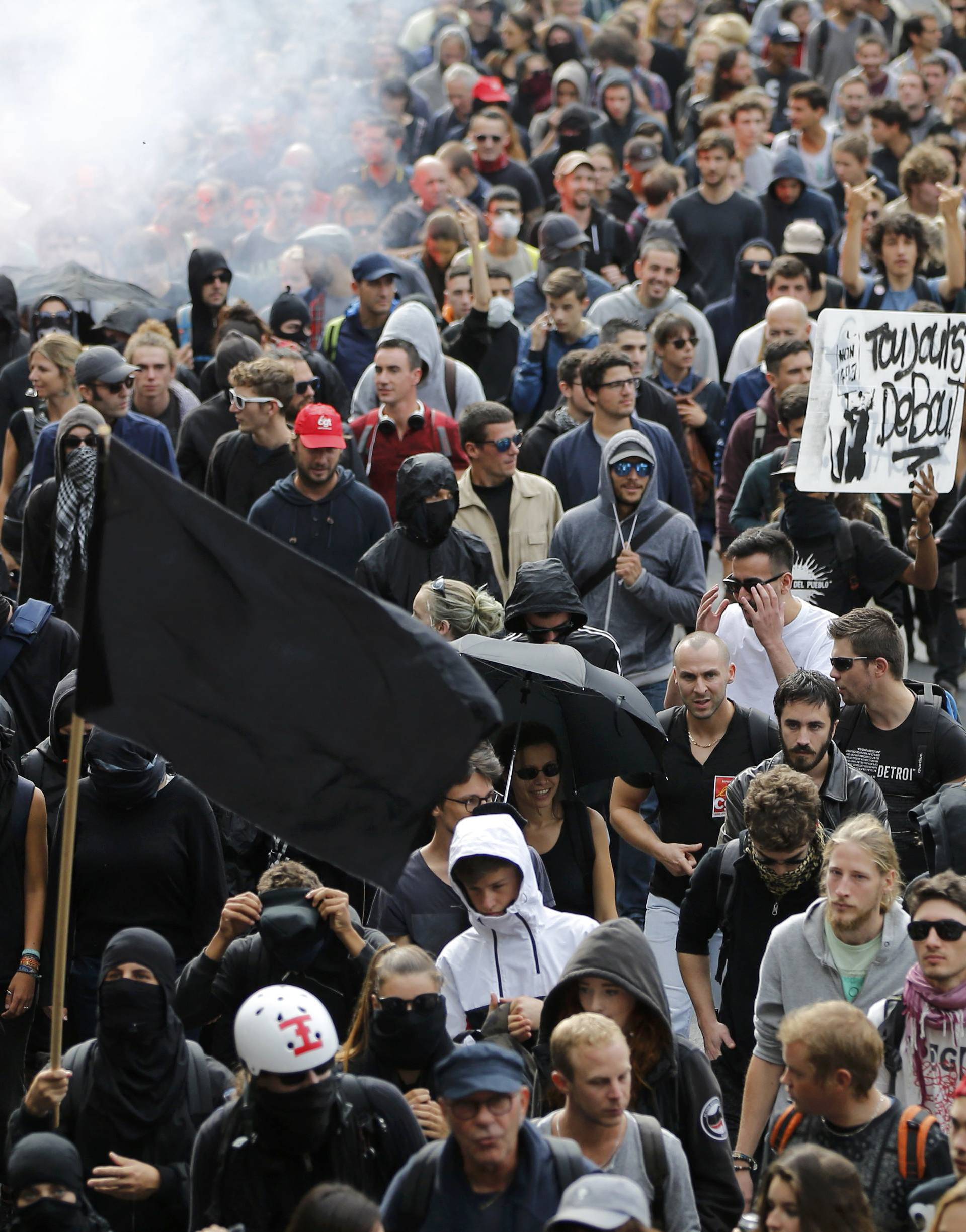 Protesters take part in a march in Nantes to demonstrate against the new French labour law