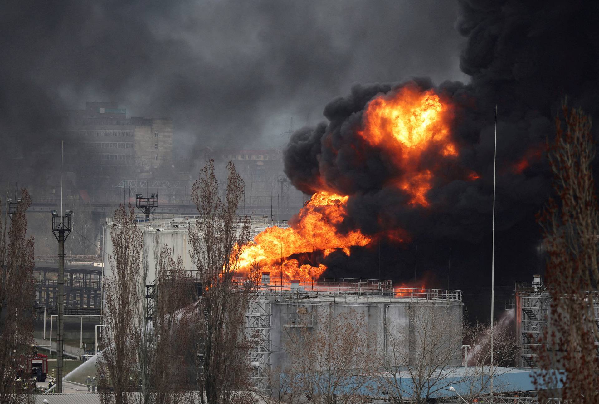 FILE PHOTO: Firefighters operate at an oil refinery which caught fire following a missile attack near the port city of Odesa, amid the ongoing Russia's invasion, in Ukraine