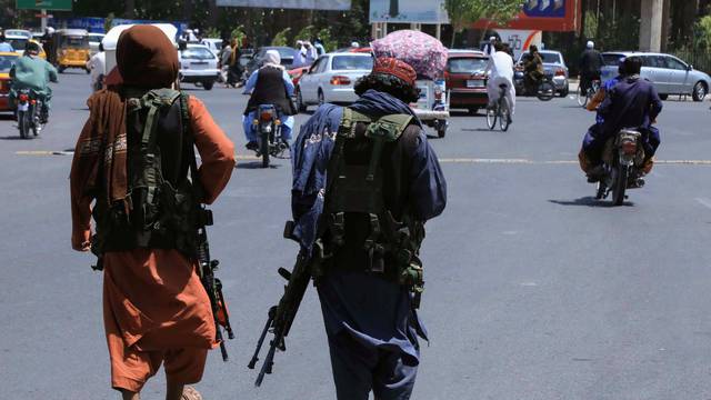 Taliban forces patrol a street in Herat