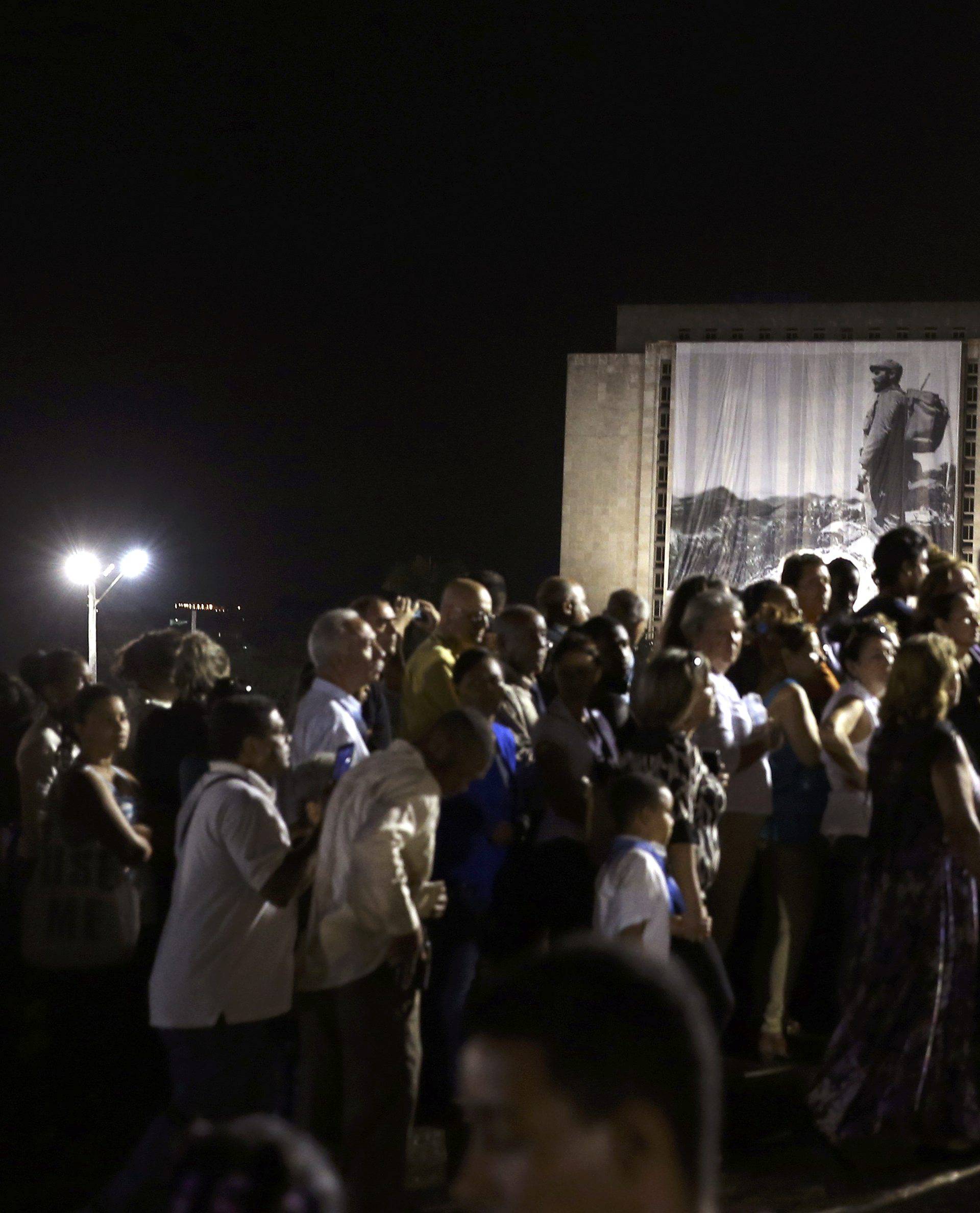 People wait in line to pay tribute to Cuba's late President Fidel Castro at the Jose Marti Memorial in Revolution Square in Havana