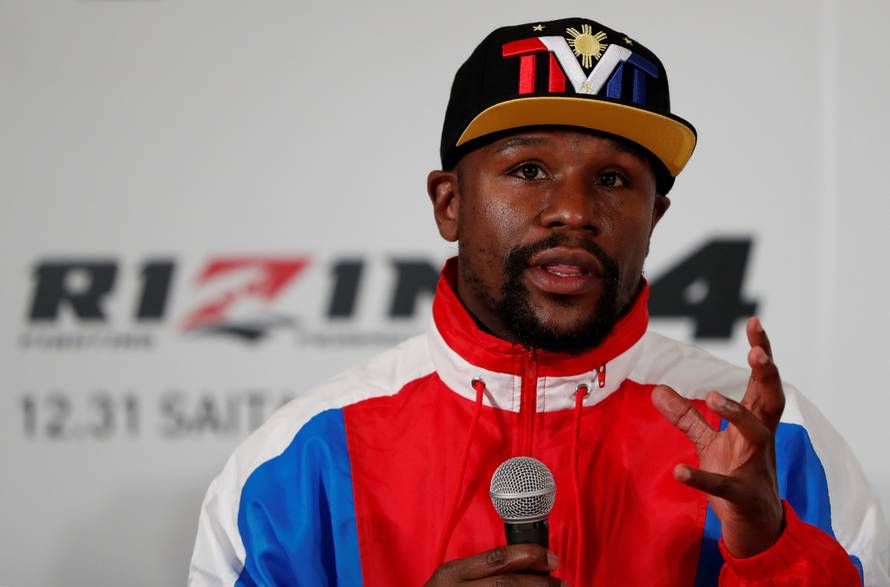 Undefeated boxer Floyd Mayweather Jr. of the U.S. attends a news conference inn Tokyo