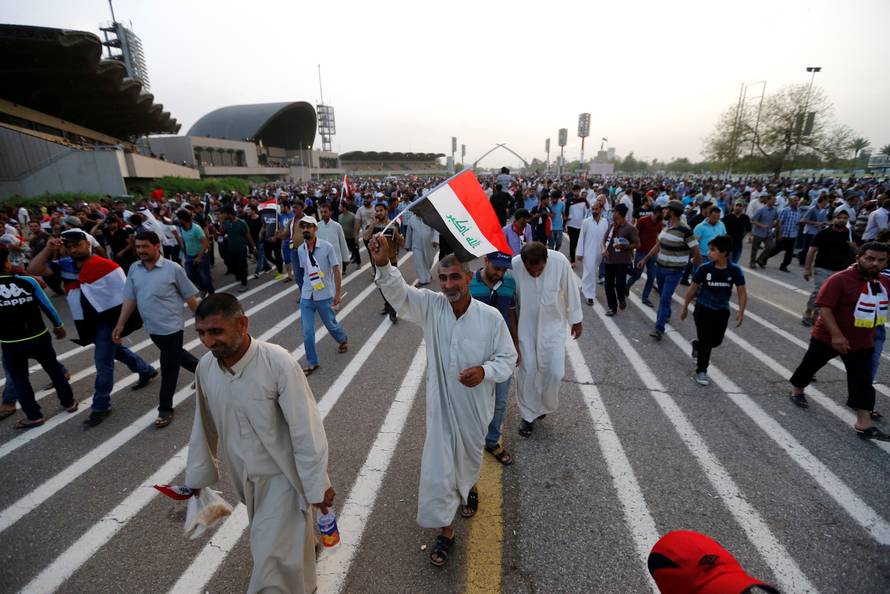 Followers of Iraqi Shi'ite cleric Moqtada al-Sadr leave the Green Zone in Baghdad