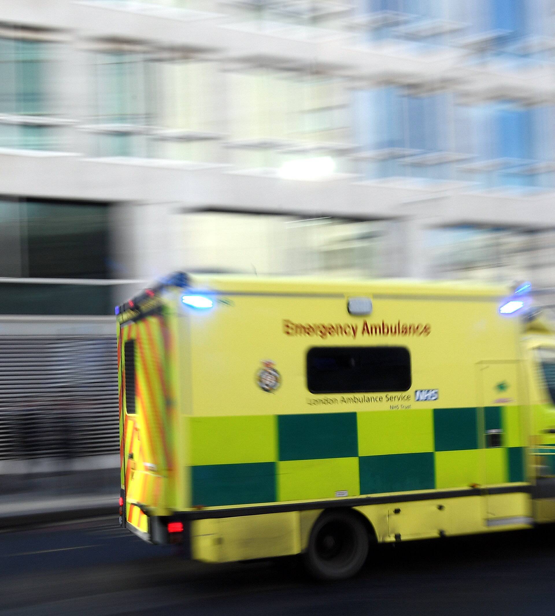 FILE PHOTO:A National Health Service London ambulance drives in London