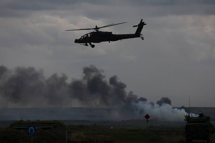 Polish forces with NATO soldiers hold military exercises 'Iron Defender' at Orzysz training ground in Wierzbiny
