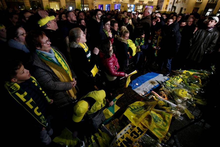 Fans gather near a row of yellow tulips in Nantes' city center after news that newly-signed Cardiff City soccer player Emiliano Sala was missing after the light aircraft he was travelling in disappeared between France and England
