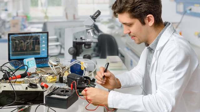 Young,Energetic,Male,Tech,Or,Engineer,Repairs,Electronic,Equipment,In