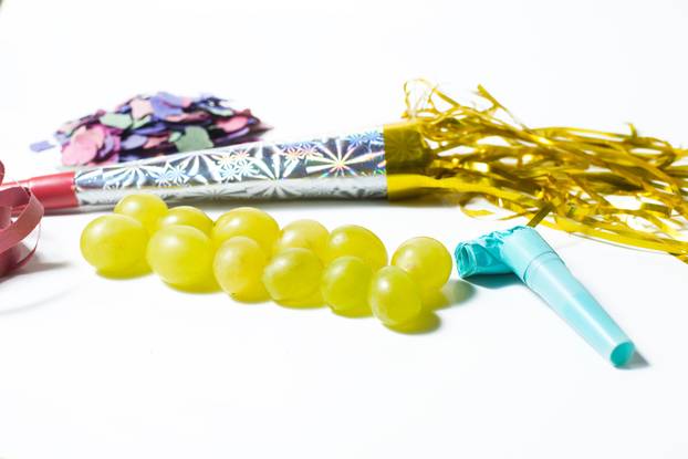 Twelve grapes and utensils for New Year's holiday