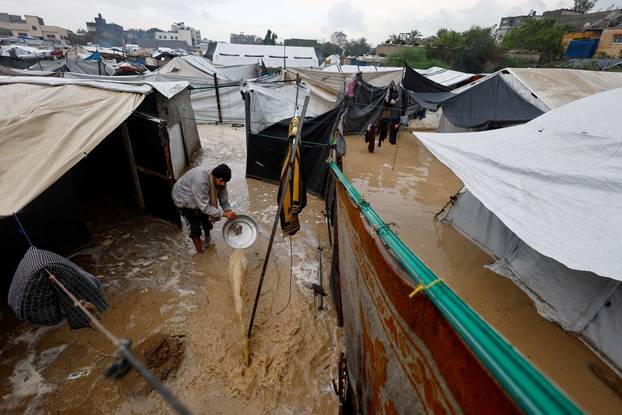 Displaced Palestinians shelter in a tent camp in Nuseirat