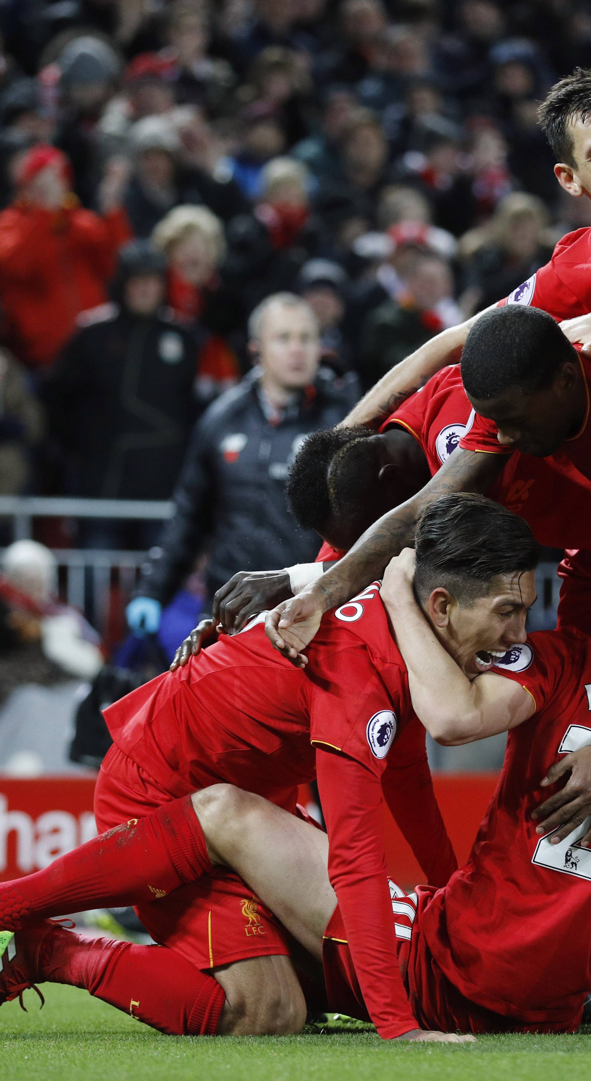 Liverpool's Roberto Firmino celebrates scoring their second goal with team mates