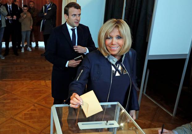 Brigitte Trogneux, the wife of French presidential election candidate Emmanuel Macron casts her ballot during the the second round of 2017 French presidential election, in Le Touquet