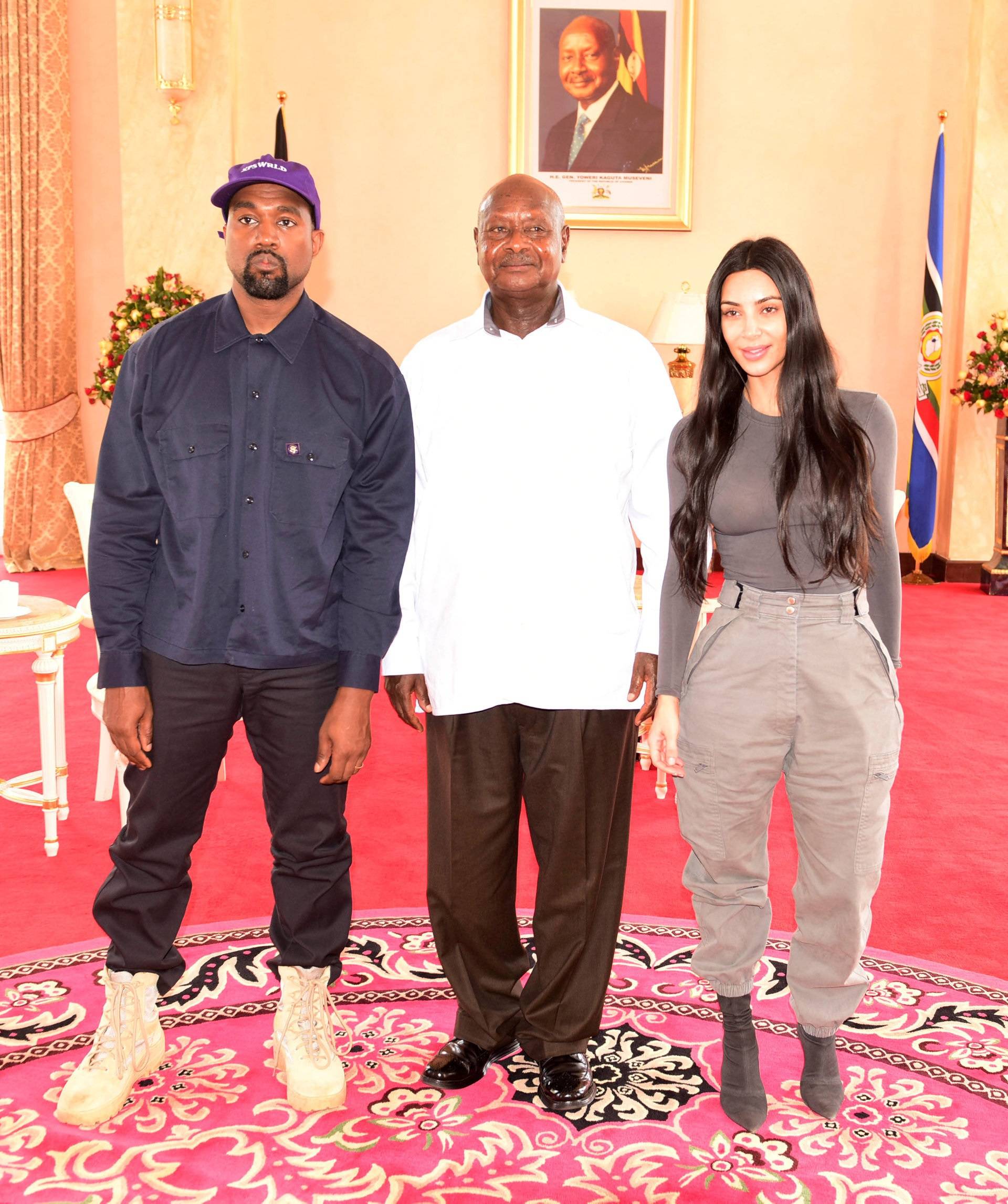 Rapper Kanye West and Kim Kardashian pose for a photograph with Uganda's President Yoweri Museveni when they paid a courtesy call at State House, Entebbe