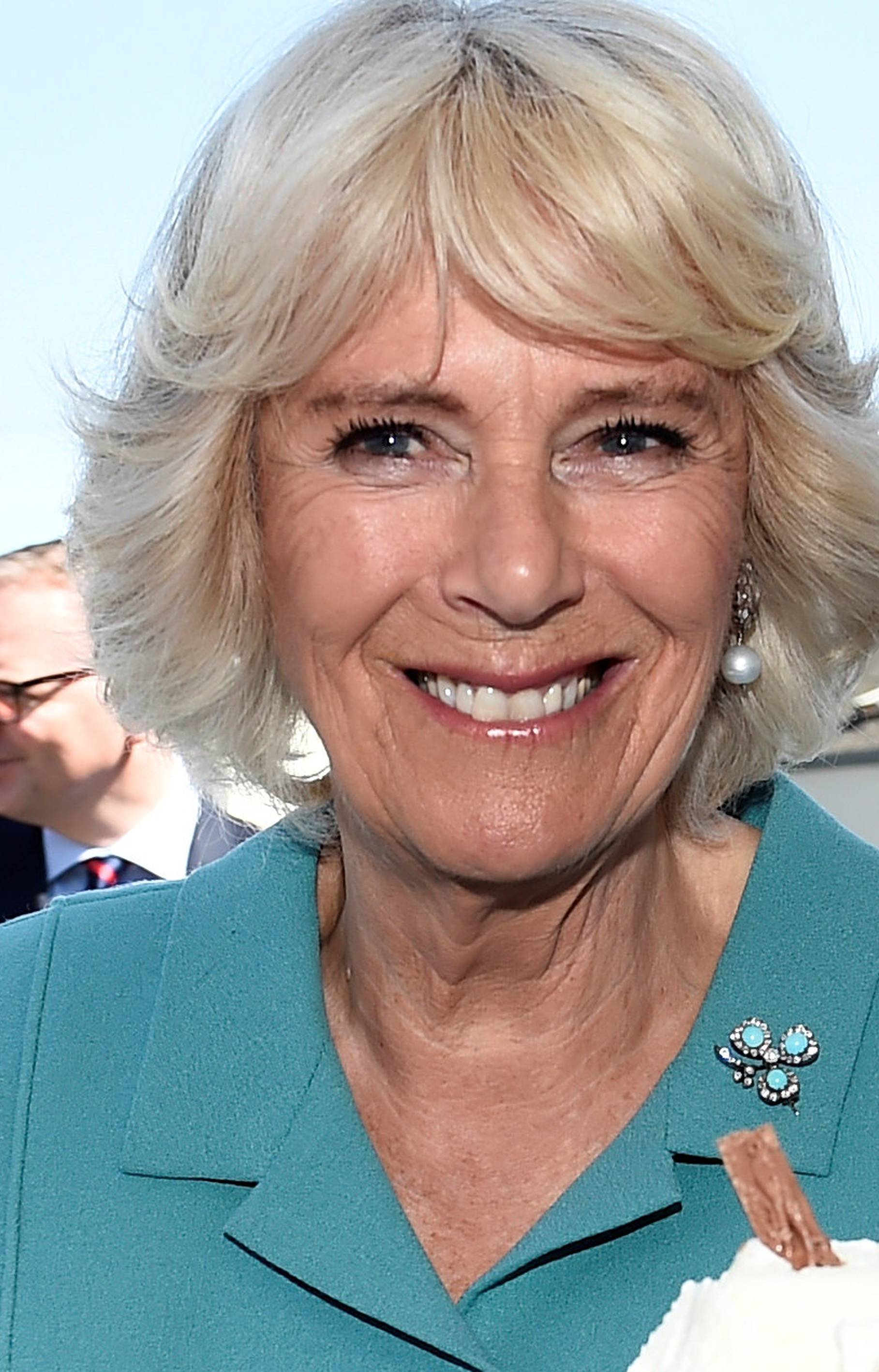 Britain's Camilla Duchess of Cornwall enjoys an ice cream during a visit to Dromore Village in County Down, Northen Ireland