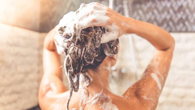 Beautiful woman taking shower