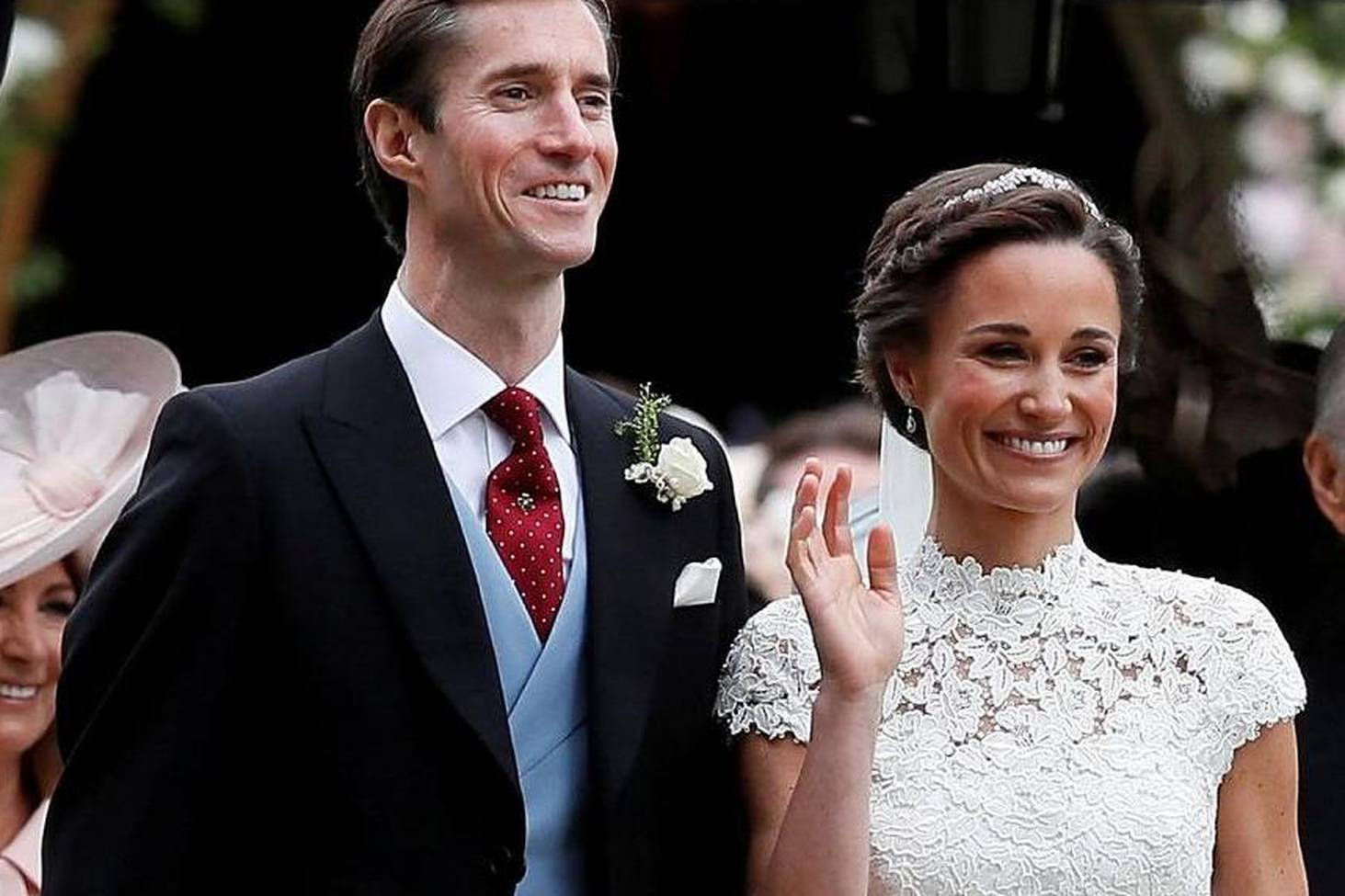 FILE PHOTO: Pippa Middleton and James Matthews pose for photographs after their wedding at St Mark's Church in Englefield