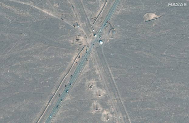 A satellite image shows new vehicle revetments and trucks on the road 1.1 kilometres from the Fordow nuclear facility, near Qom