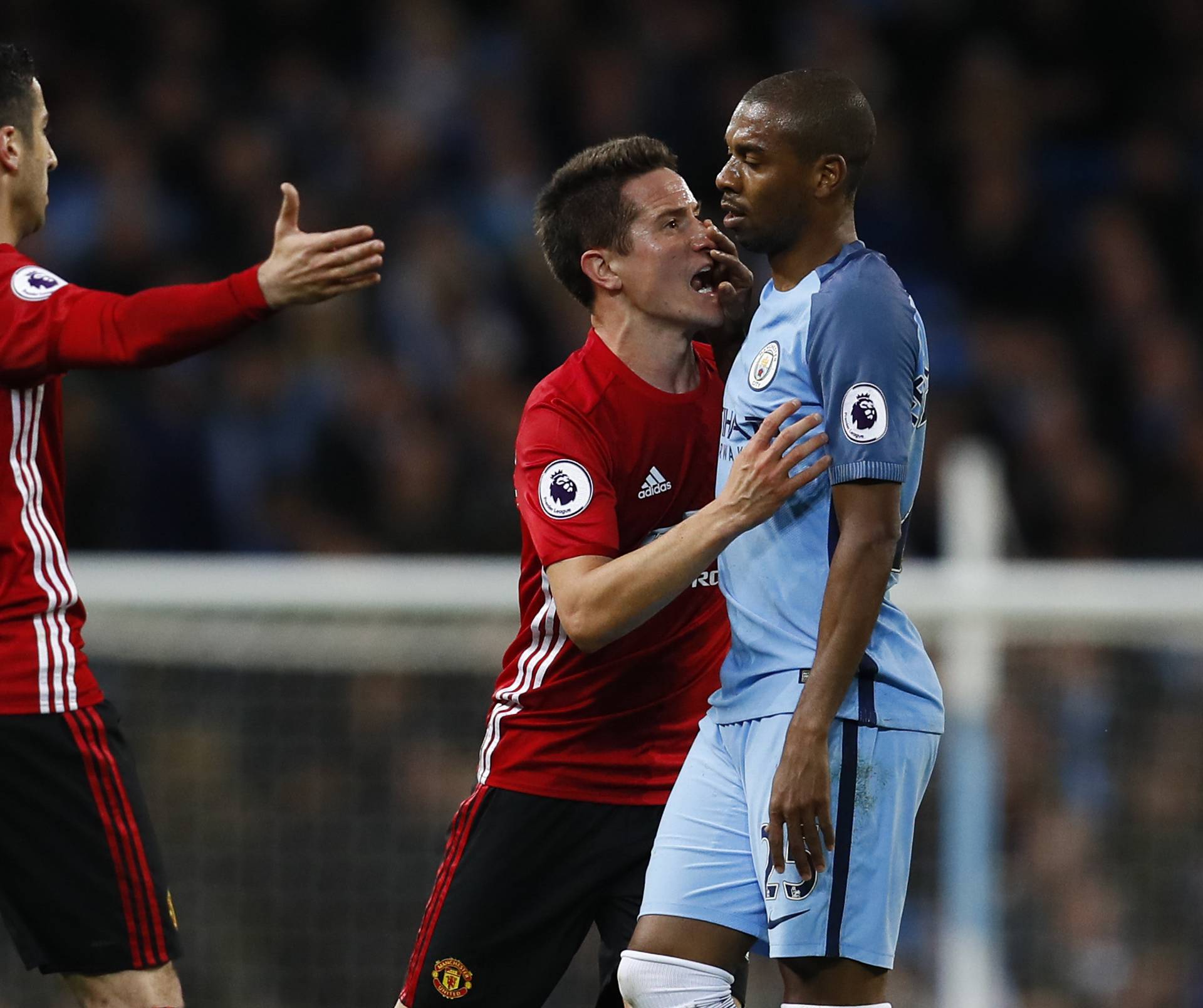 Manchester City's Fernandinho clashes with Manchester United's Ander Herrera