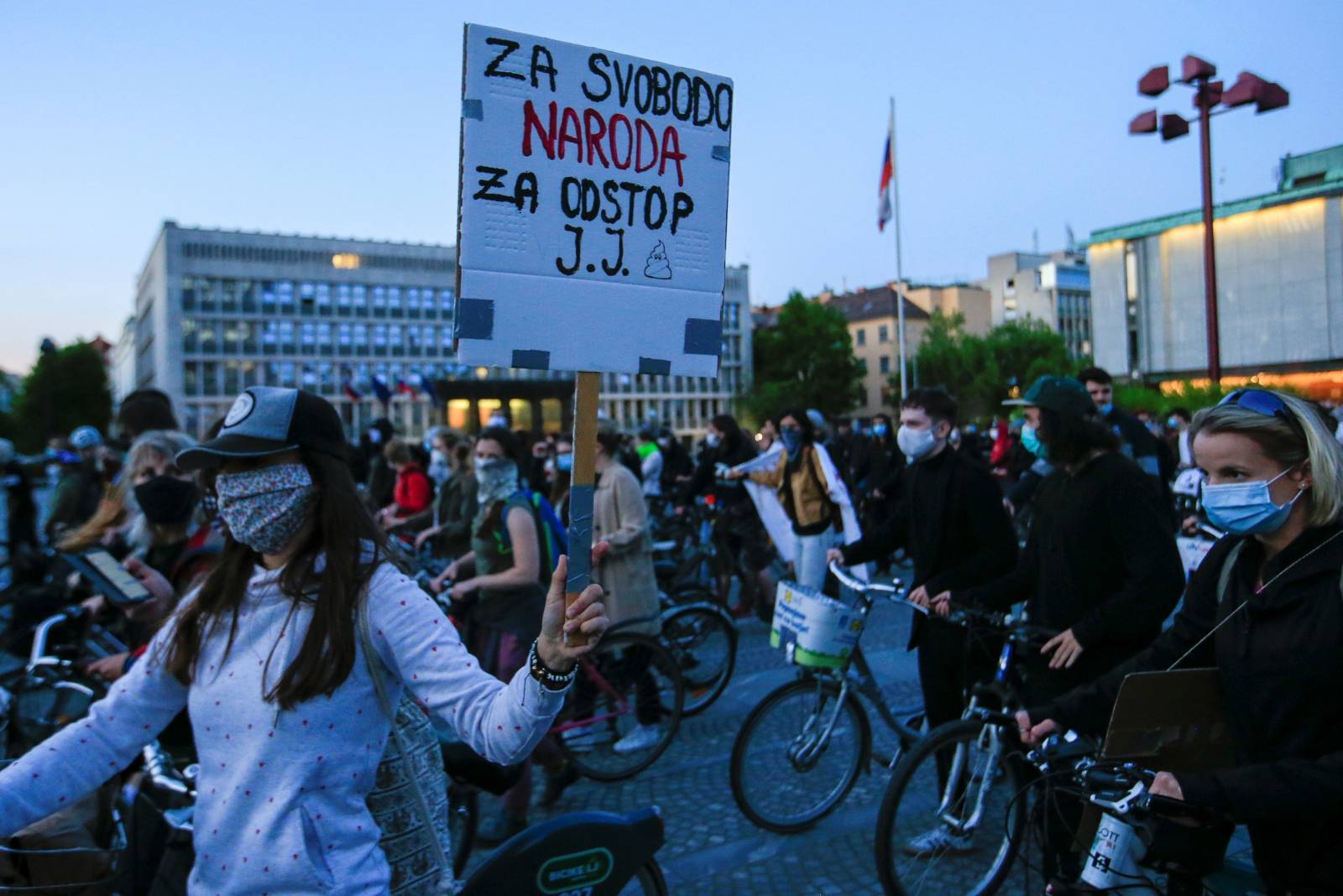 Protesters ride bicycles during an anti-government protest in Ljubljana