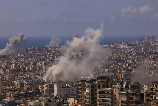 Smoke rises following an Israeli strike on the southern suburbs of Beirut