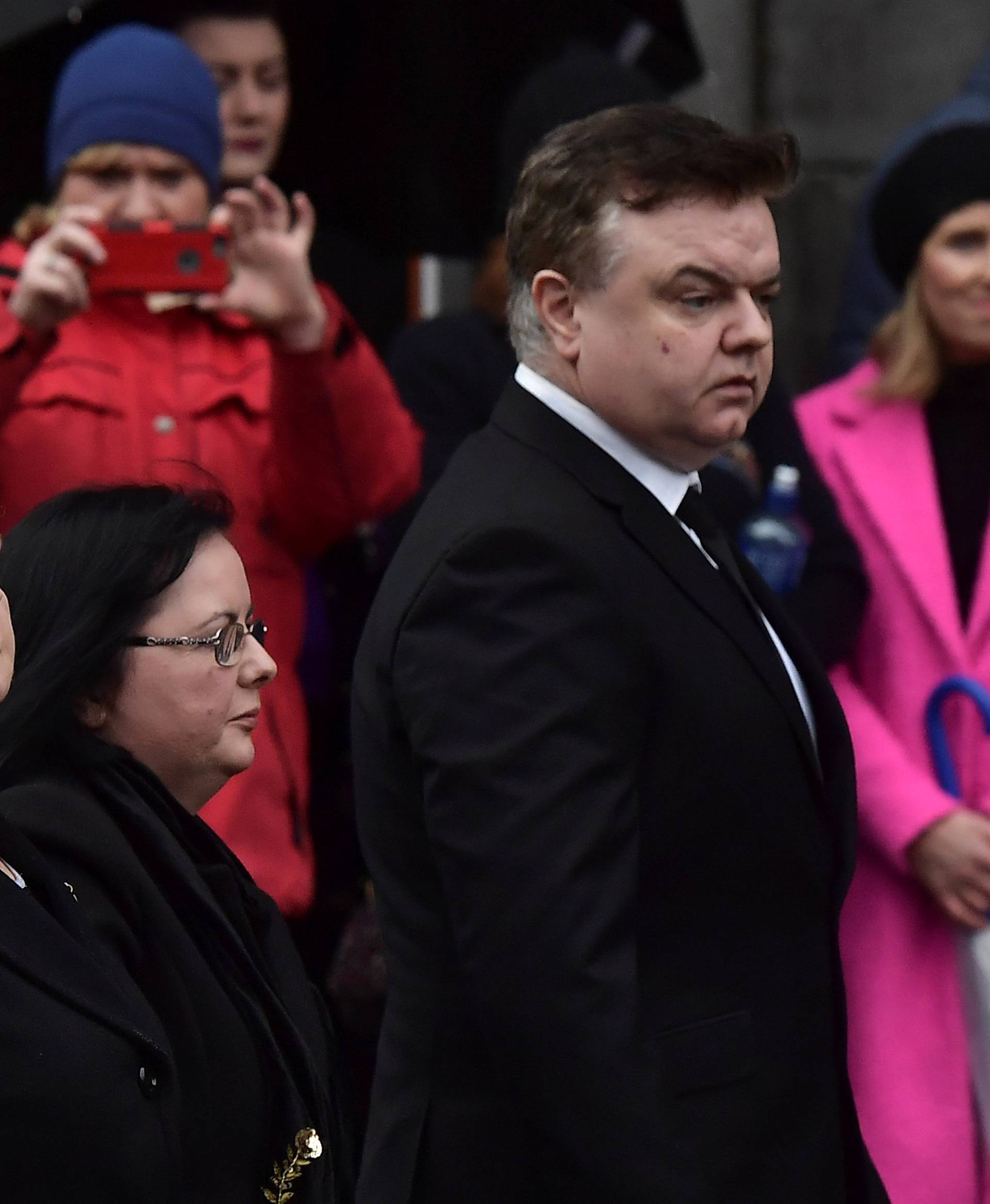 Eileen O'Riordan, mother of Dolores O'Riordan, singer with the Cranberries looks on as her daughter's coffin is brought into St. Joseph's Church for a public reposal in Limerick