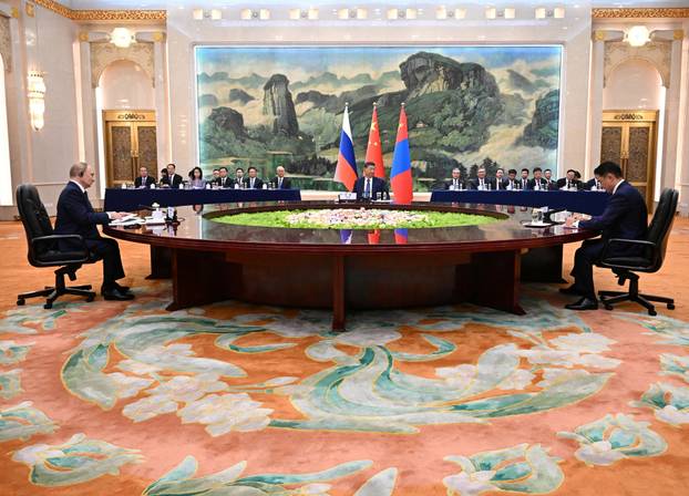 Russian President Vladimir Putin meets with Chinese President Xi Jinping and Mongolian President Ukhnaagiin Khurelsukh in Beijing