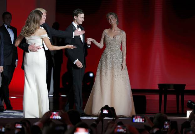 U.S. President Donald Trump and his wife first lady Melania Trump gesture towards his daughter Ivanka and her husband Jared Kushner at his "Liberty" Inaugural Ball in Washington