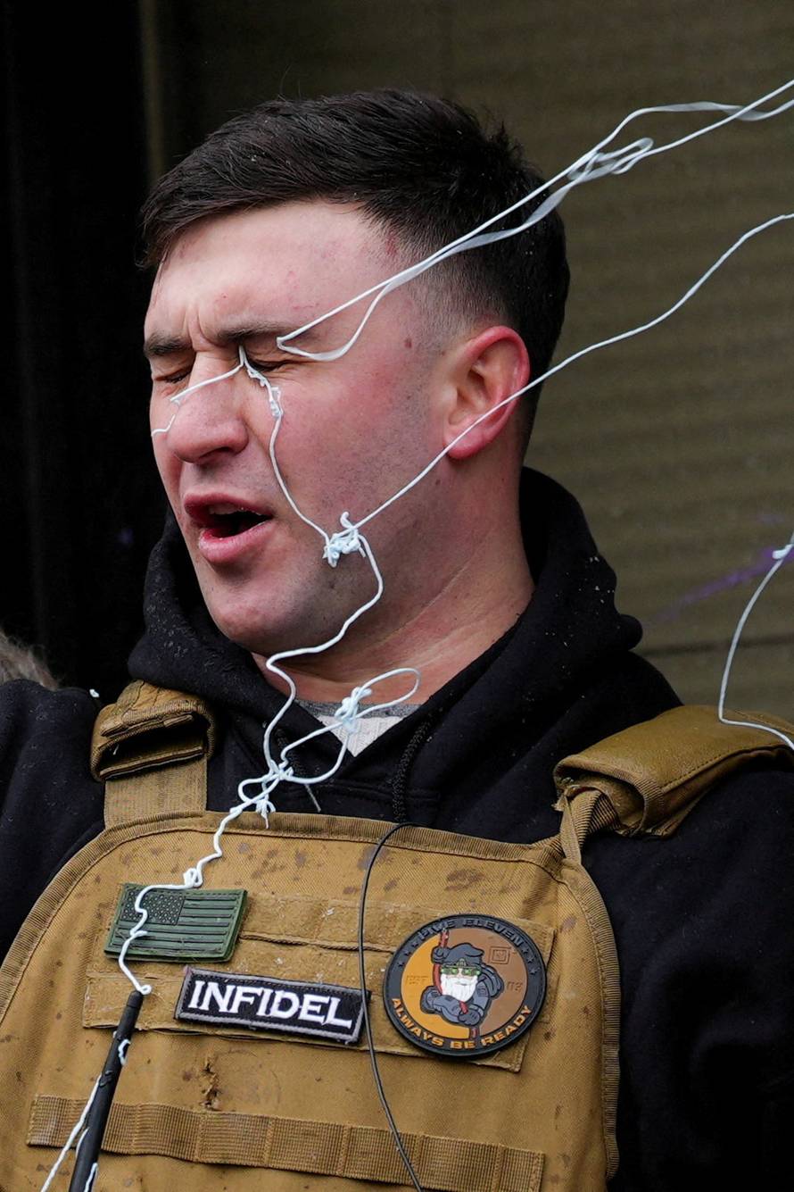 People attend the "March Against Minnesota Fraud" in Minneapolis