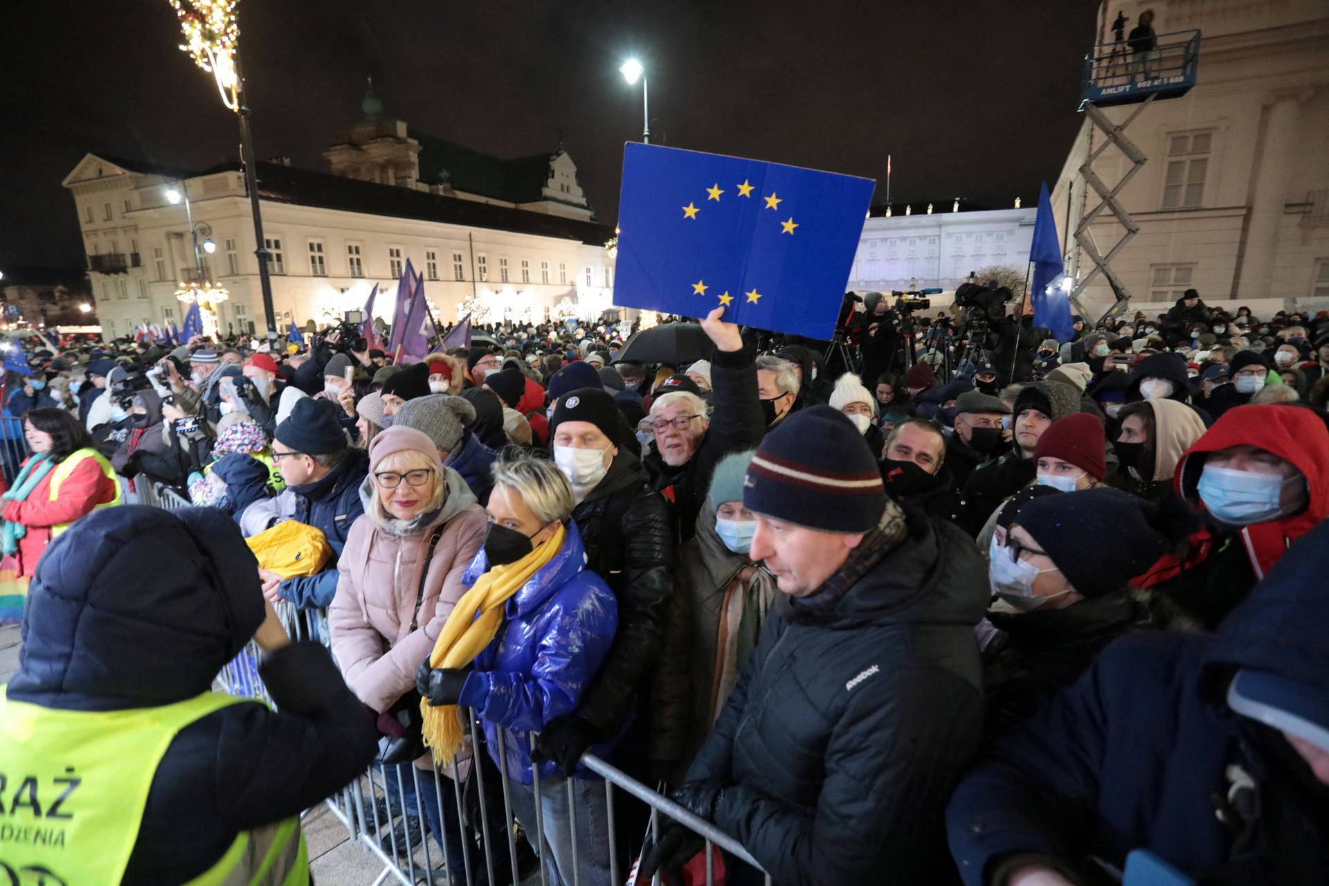 People protest against media law affecting U.S.-owned news channel in Warsaw