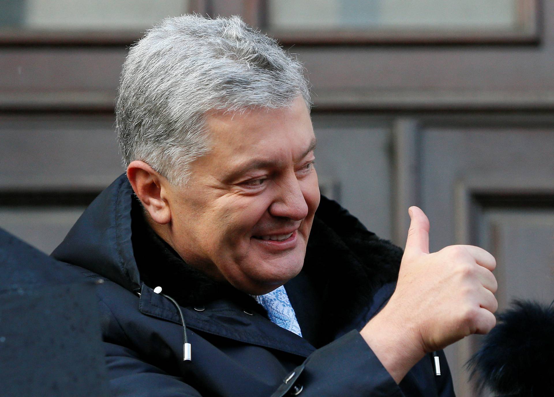 Ukrainian former President Poroshenko leaves a court building in Kyiv