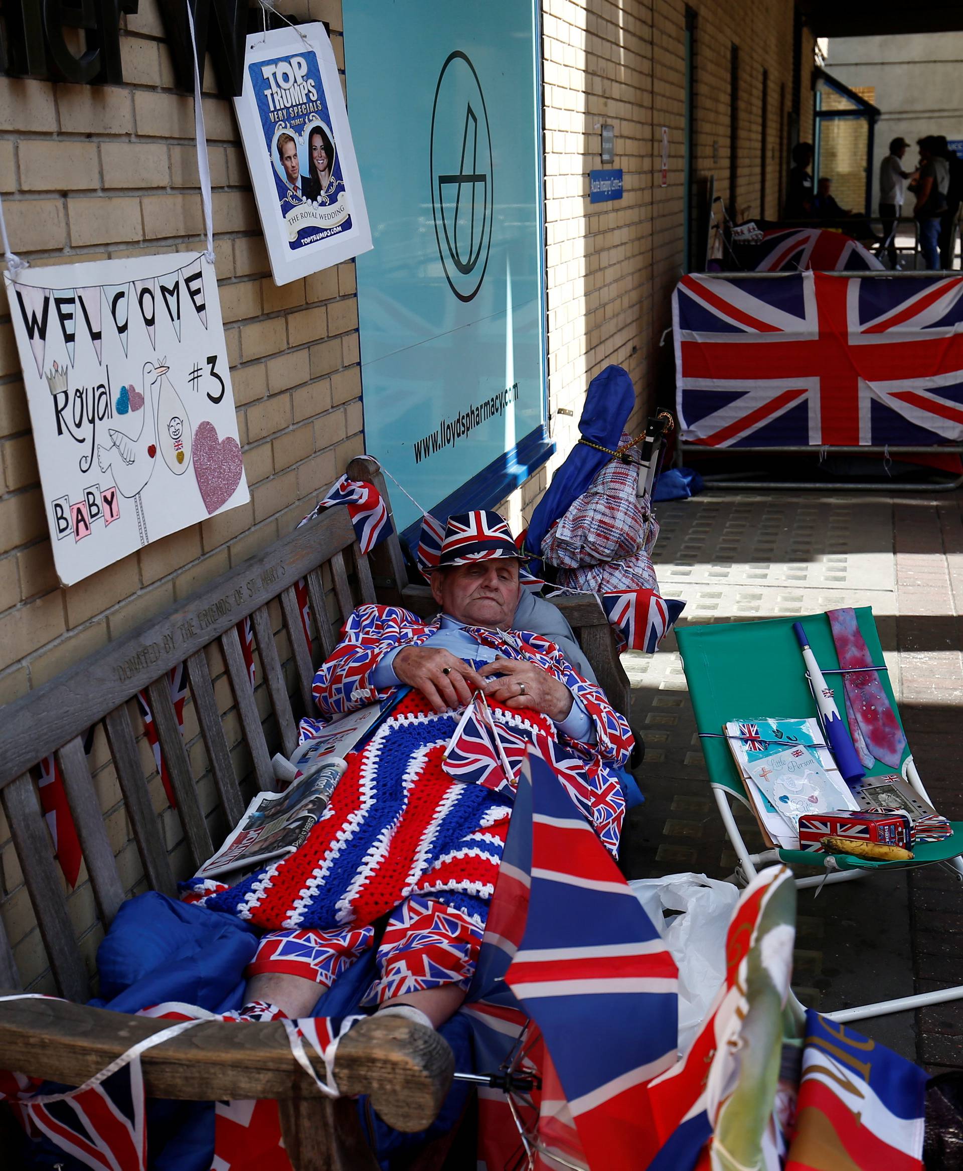 A fan of Britain's royal family camps outside the hospital where Catherine, Duchess of Cambridge is due to give birth, in London