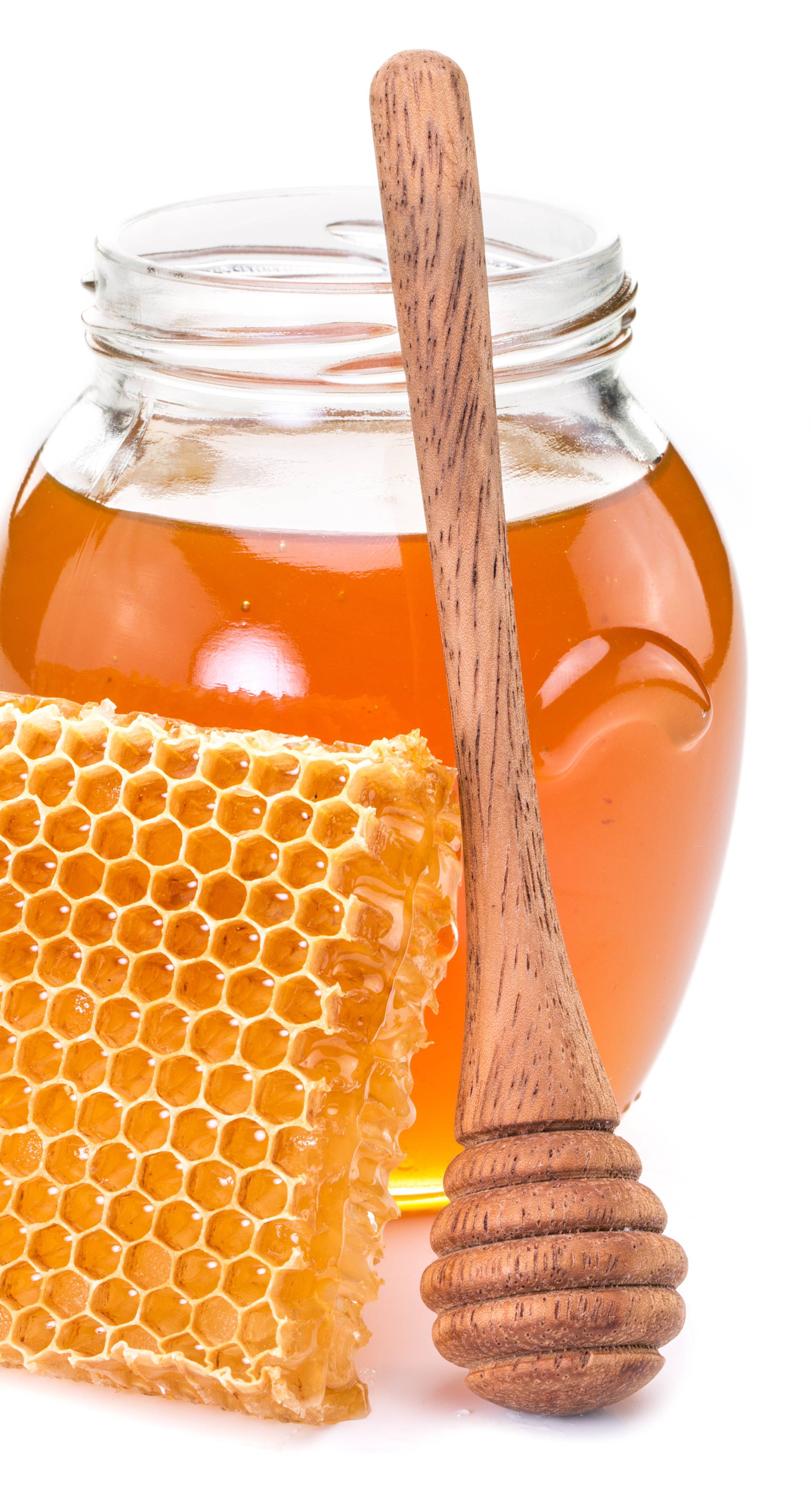Jar full of fresh honey and honeycombs.