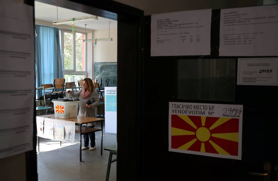 A woman casts her ballot for the referendum in Macedonia on changing the country's name that would open the way for it to join NATO and the European Union in Skopje