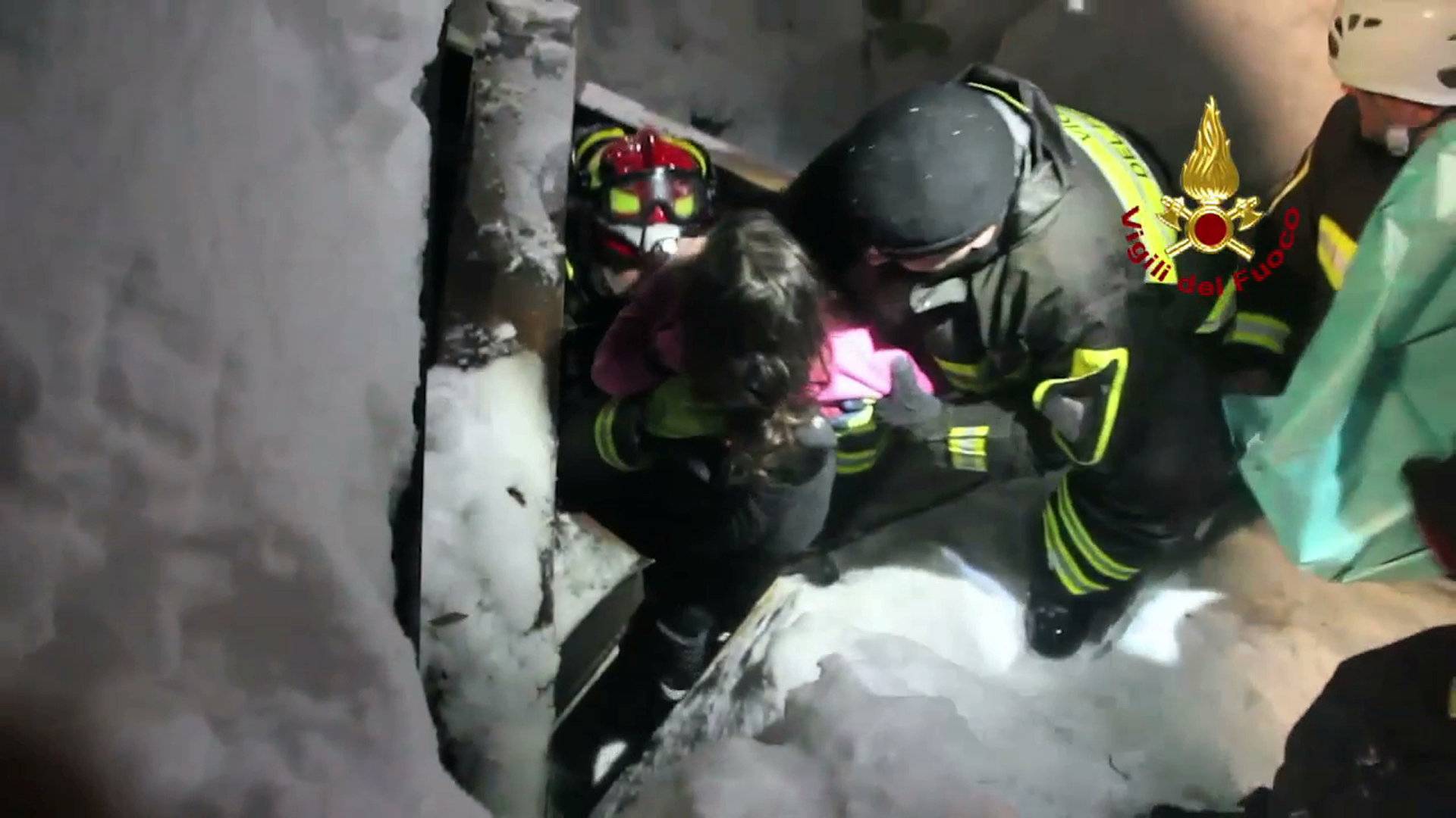 A still image taken from a video shows a survivor, rescued by Italian firefighters, at the Hotel Rigopiano in Farindola, central Italy, which was hit by an avalanche