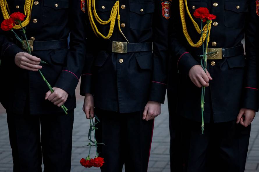 People attend a ceremony marking the anniversary of the Chornobyl nuclear disaster in Kyiv