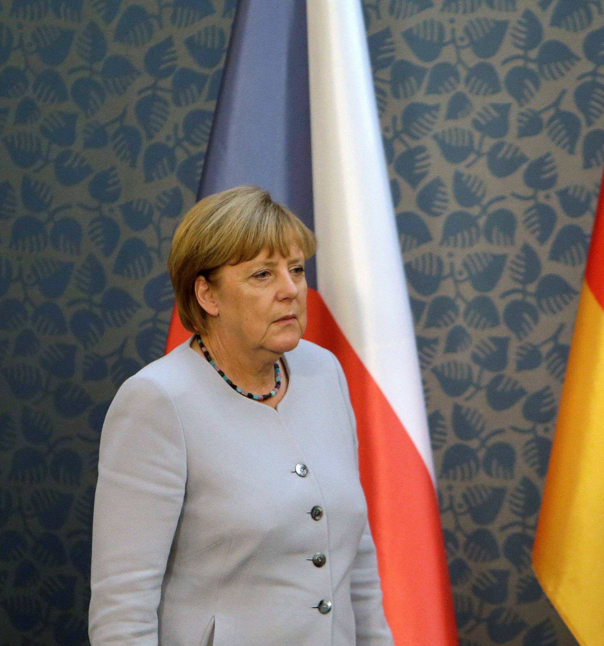 Merkel arrives at a news conference at Czech government headquarters in Prague